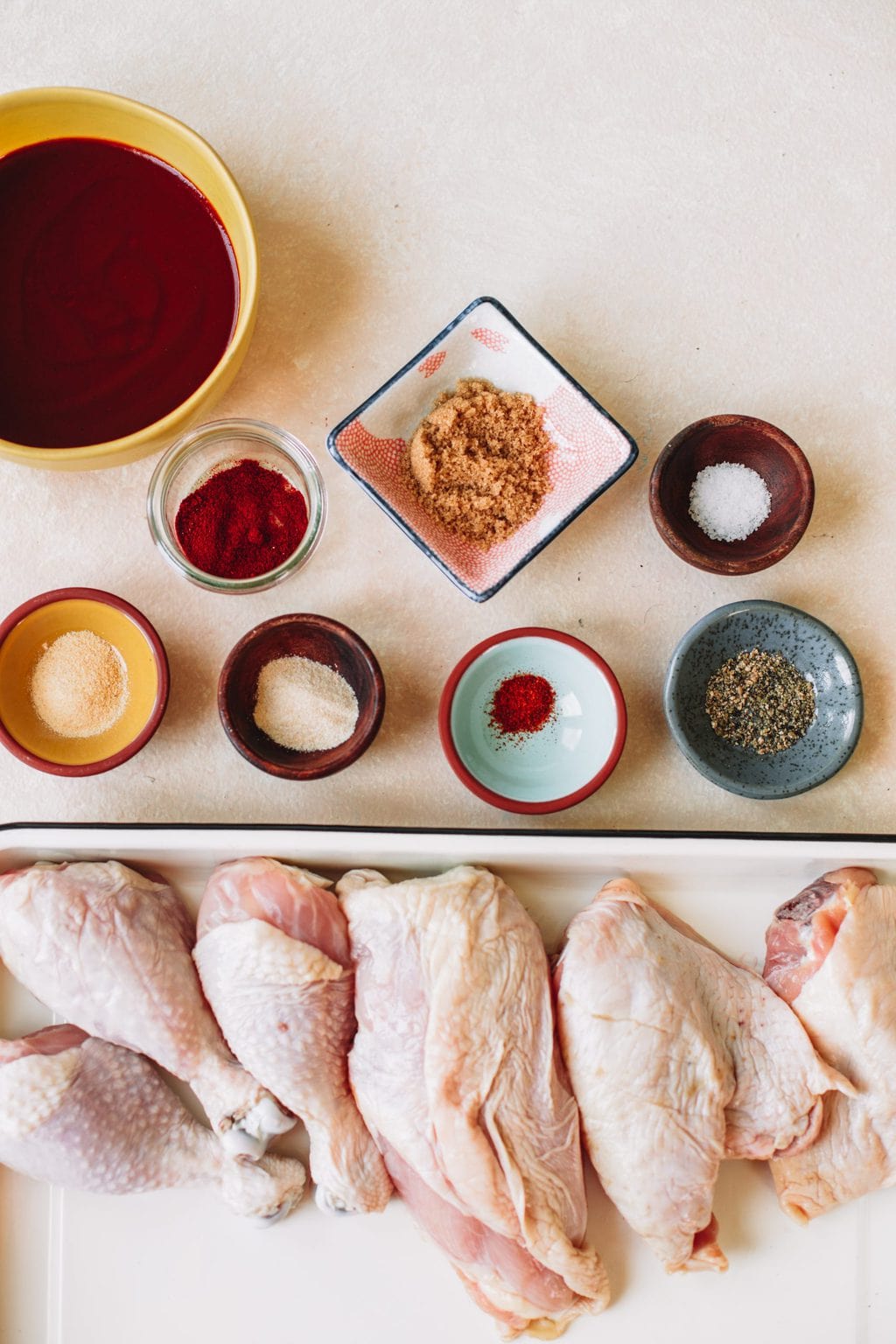 Bbq sauce, garlic powder, smoked paprika, brown sugar, onion powder, cayenne pepper, salt, pepper and bone in chicken.