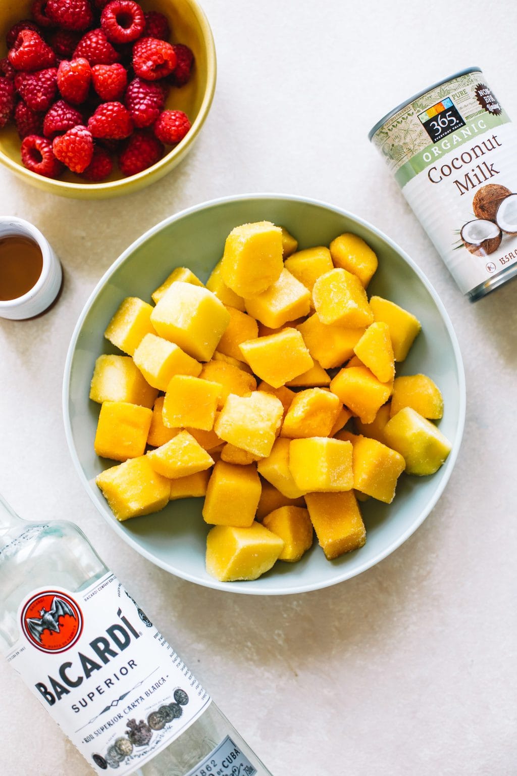 Bowls of ingredients for mango ice cream. 