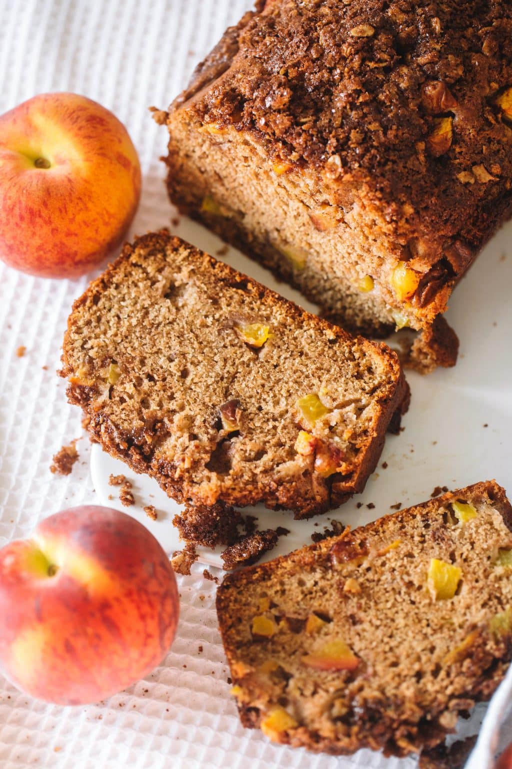 Peach bread with a slice cut off.