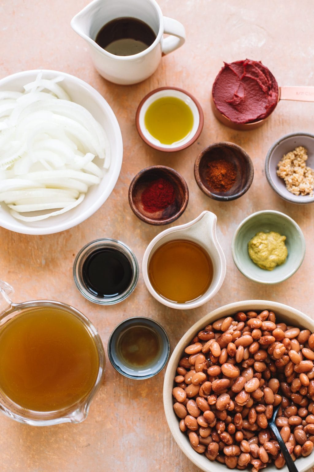 sliced onions, chili powder, smoked paprika, olive oil, garlic, tomato paste, maple syrup, beans