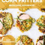 easy zucchini and corn fritters on parchment paper topped with creamy sauce and chives