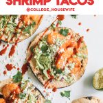 easy chipotle spiced shrimp tacos with slaw and sriracha on white surface