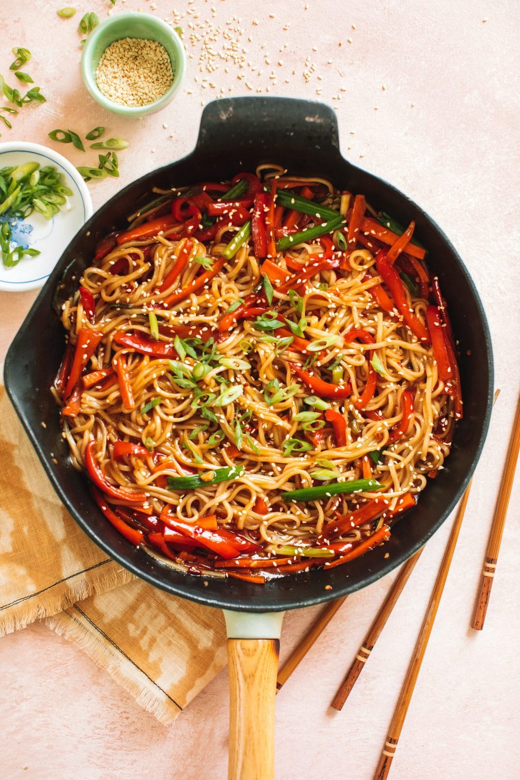 easy chili garlic noodles and sauce with vegetables in cast iron pan