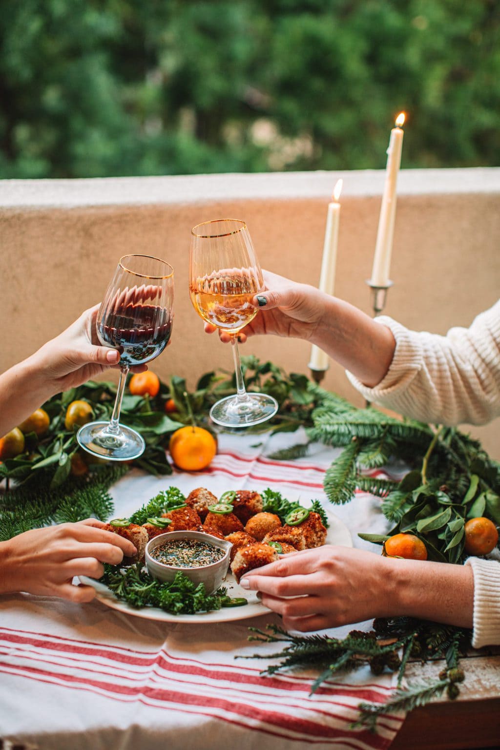 Glasses of wine being cheersed. 