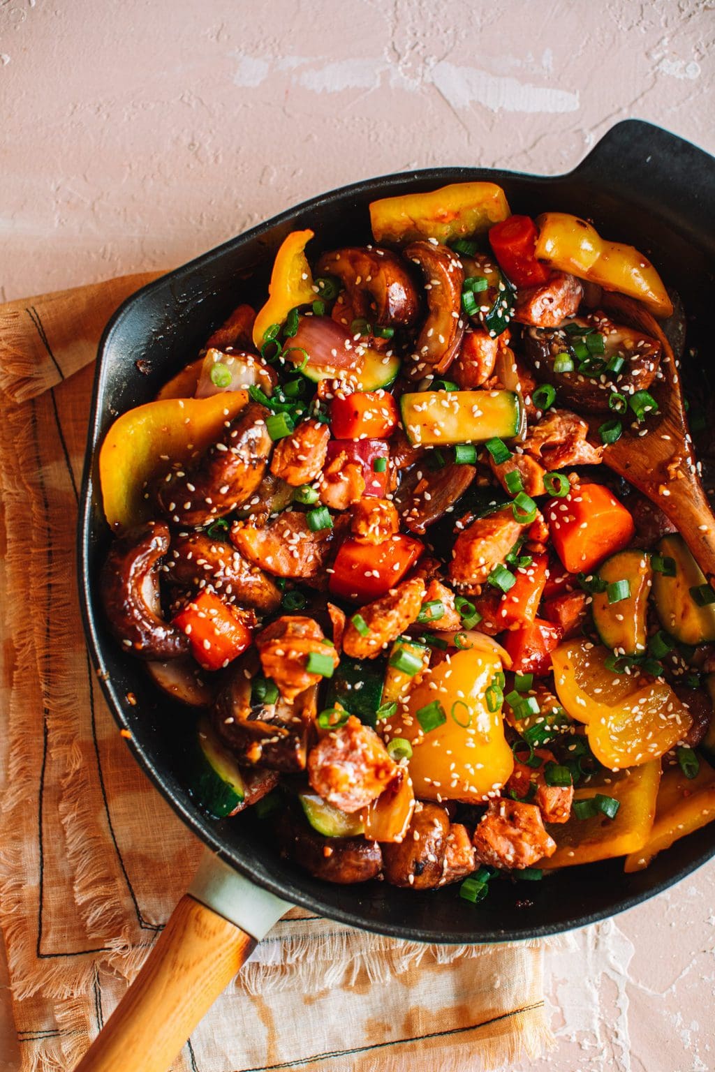 easy salmon stir fry recipe garnished with sesame seeds in skillet