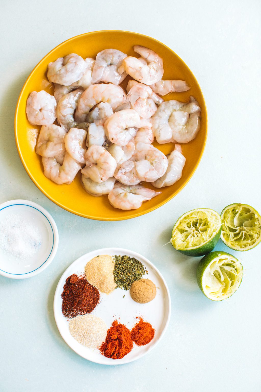 Ingredients for seafood recipe on white background.