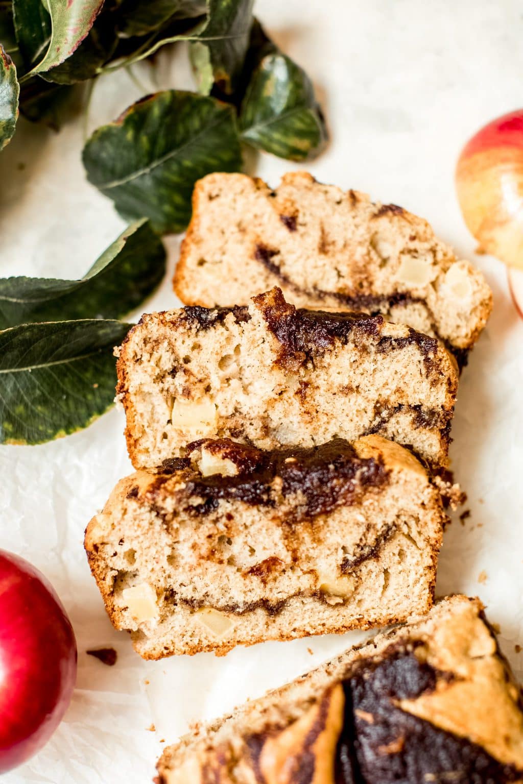 sliced apple loaf cake on white background