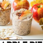 hand pouring maple syrup into glass filled with apple overnight oats