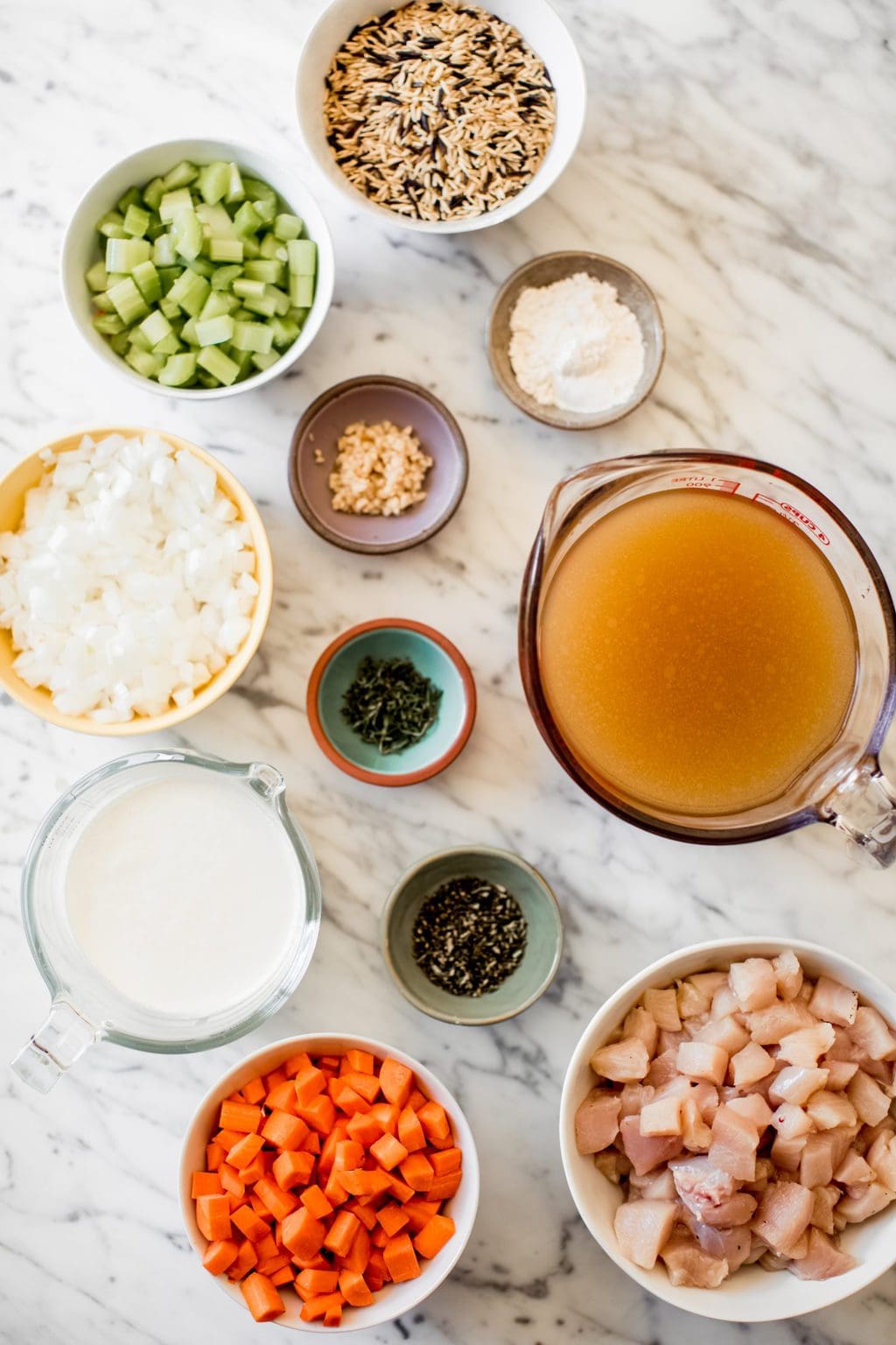 onions, celery, wild rice, heavy cream, garlic, flour, rosemary, thyme, carrots, chicken stock, chicken breast