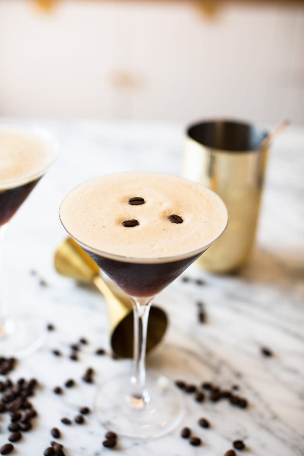 coffee cocktail garnished with three espresso beans