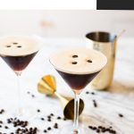 two espresso martinis garnished with three coffee beans each