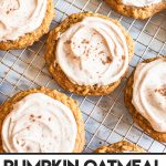 pumpkin oat cookies with frosting on cooling rack