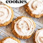 pumpkin oat cookies with frosting on cooling rack