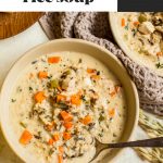 creamy chicken and rice soup in a bowl with a spoon