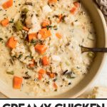 creamy chicken and rice soup in a beige bowl