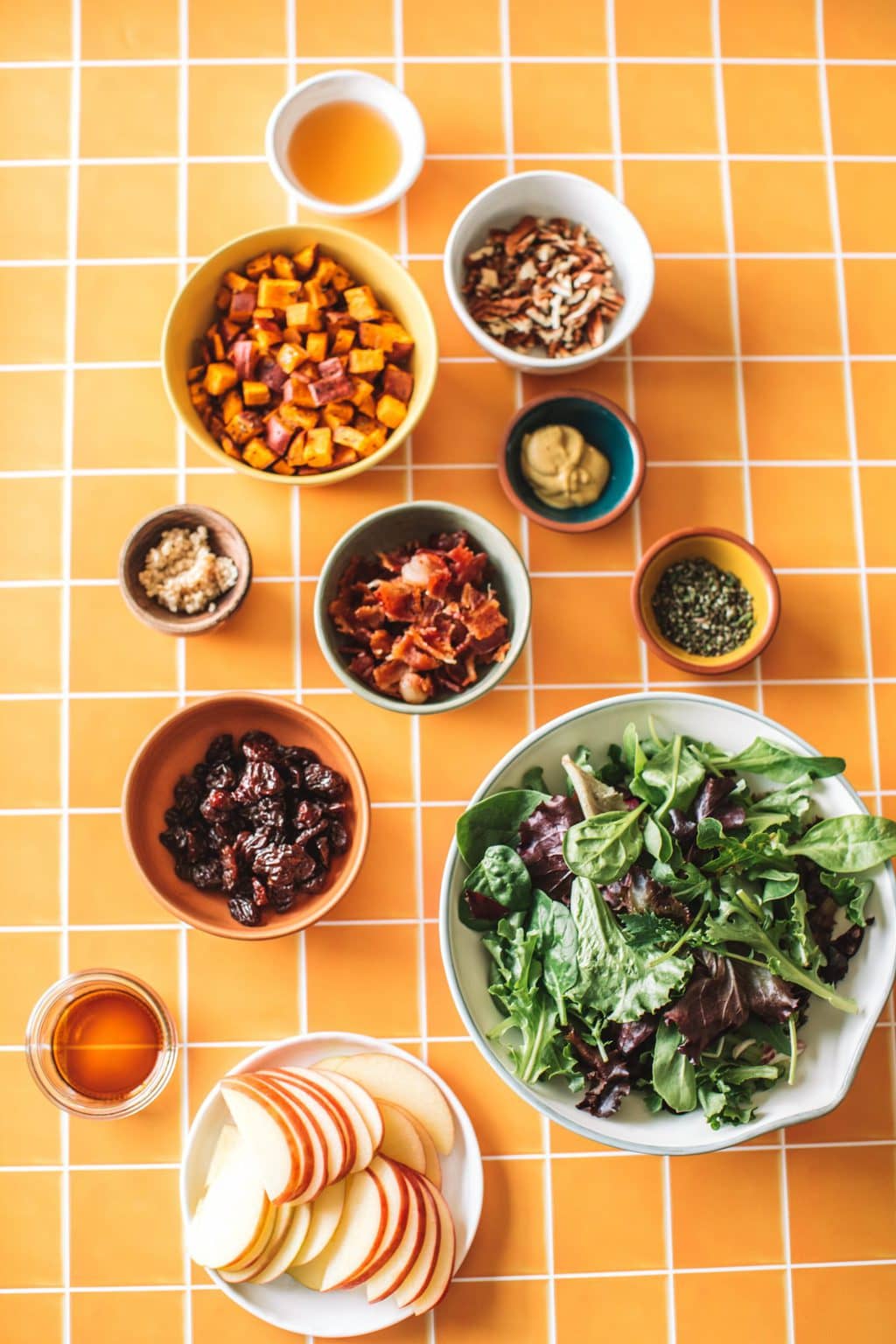 bacon, diced sweet potato, pecans, craisins, mustard, rosemary, maple syrup, salad greens