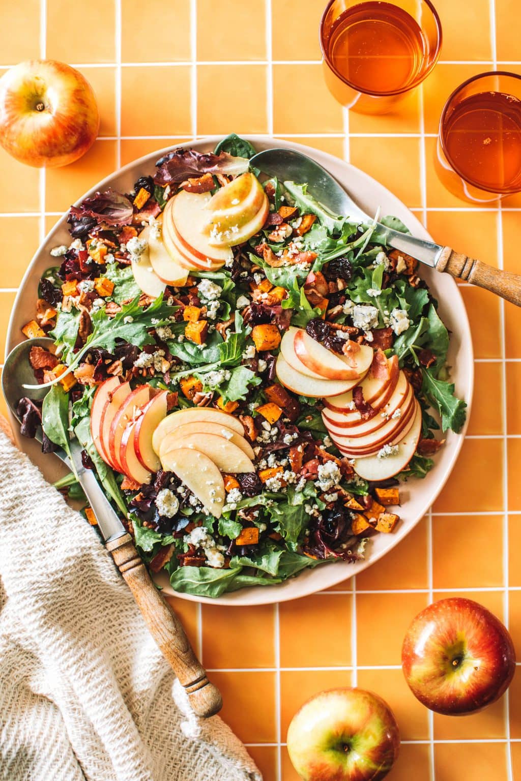 overhead of fall salad recipe with two spoons