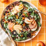 overhead of fall salad recipe with two spoons