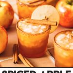 apple cider margaritas in glasses with apple slice garnish