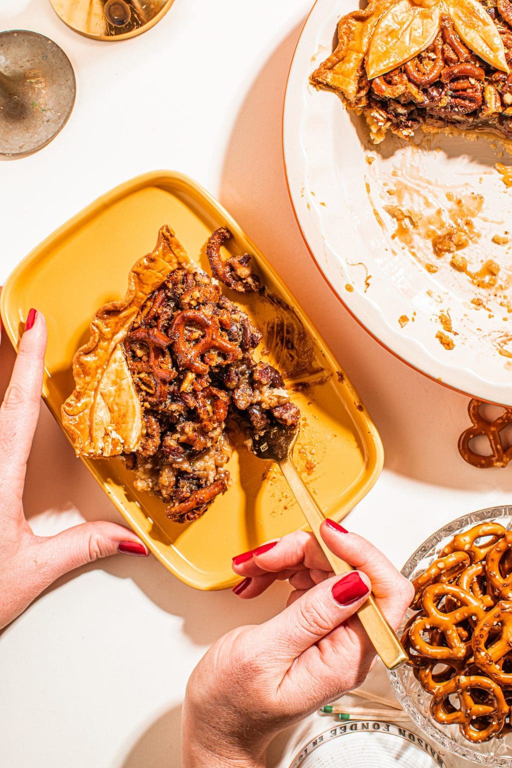 hand holding fork eating pretzel pecan pie recipe