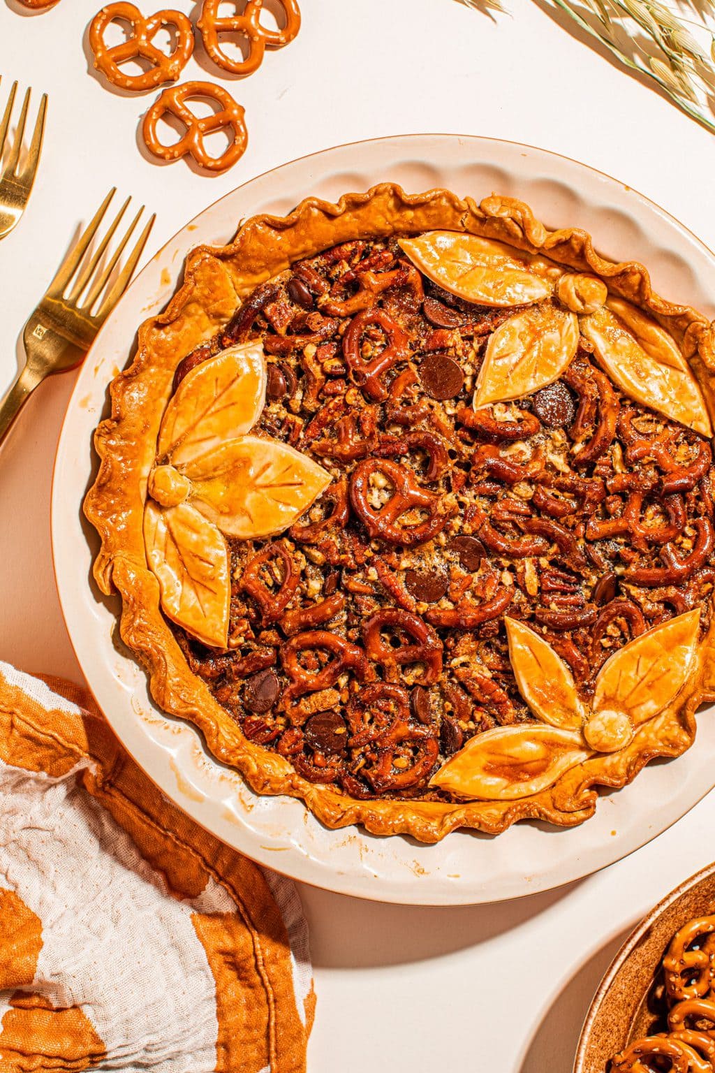 baked maple butter pecan pie with decorative topping