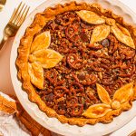 baked maple butter pecan pie with decorative topping