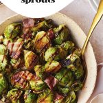 Brussel sprouts in a pink bowl drizzled with balsamic vinegar glaze.