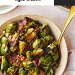 Brussel sprouts in a pink bowl drizzled with balsamic vinegar glaze.