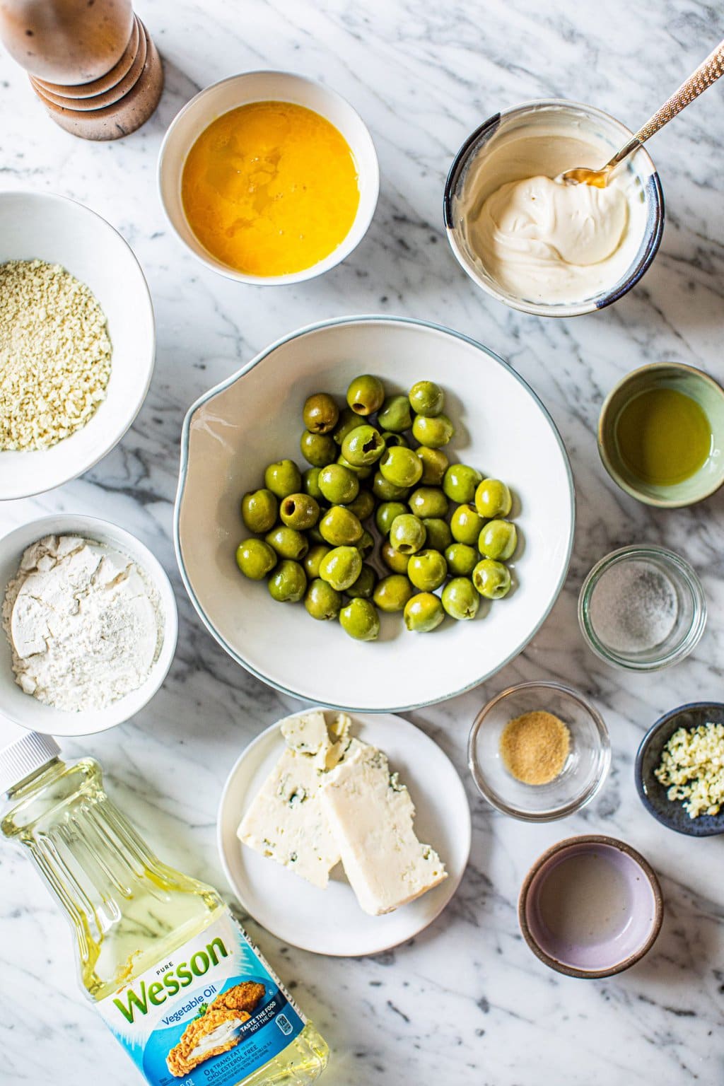 green olives, blue cheese, vegetable oil, flour, breadcrumbs, egg, mayo, lemon juice, garlic, salt