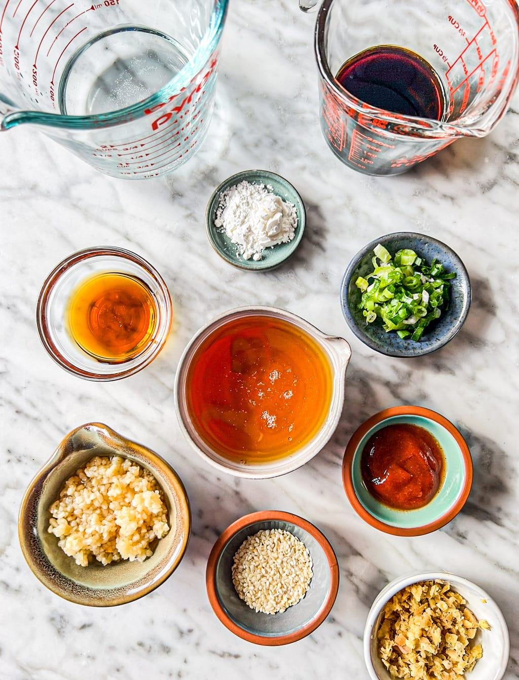 water, soy sauce, honey, garlic, sesame oil, corn starch, green onions, sriracha, ginger, sesame seeds