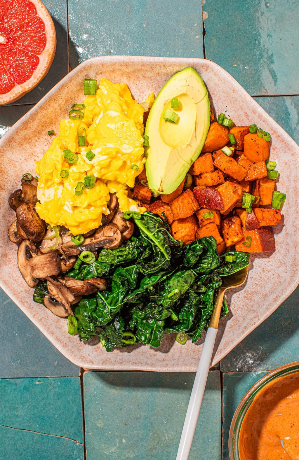 savory sweet potato breakfast bowl with eggs, kale and avocado