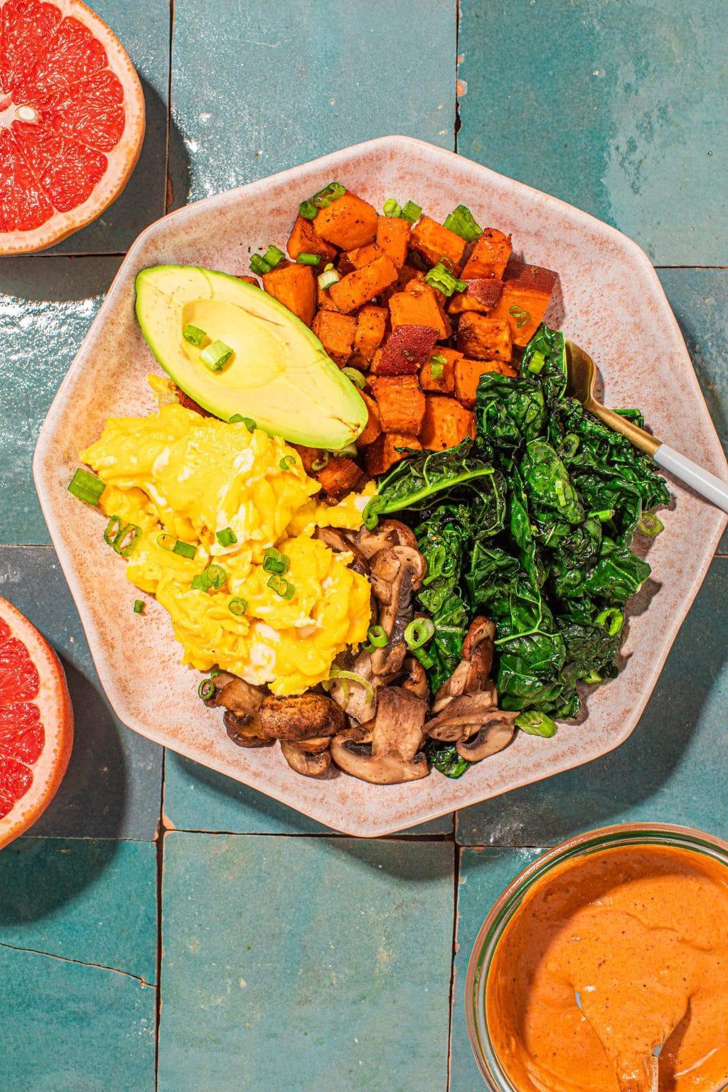 sweet potato breakfast bowl with eggs and kale