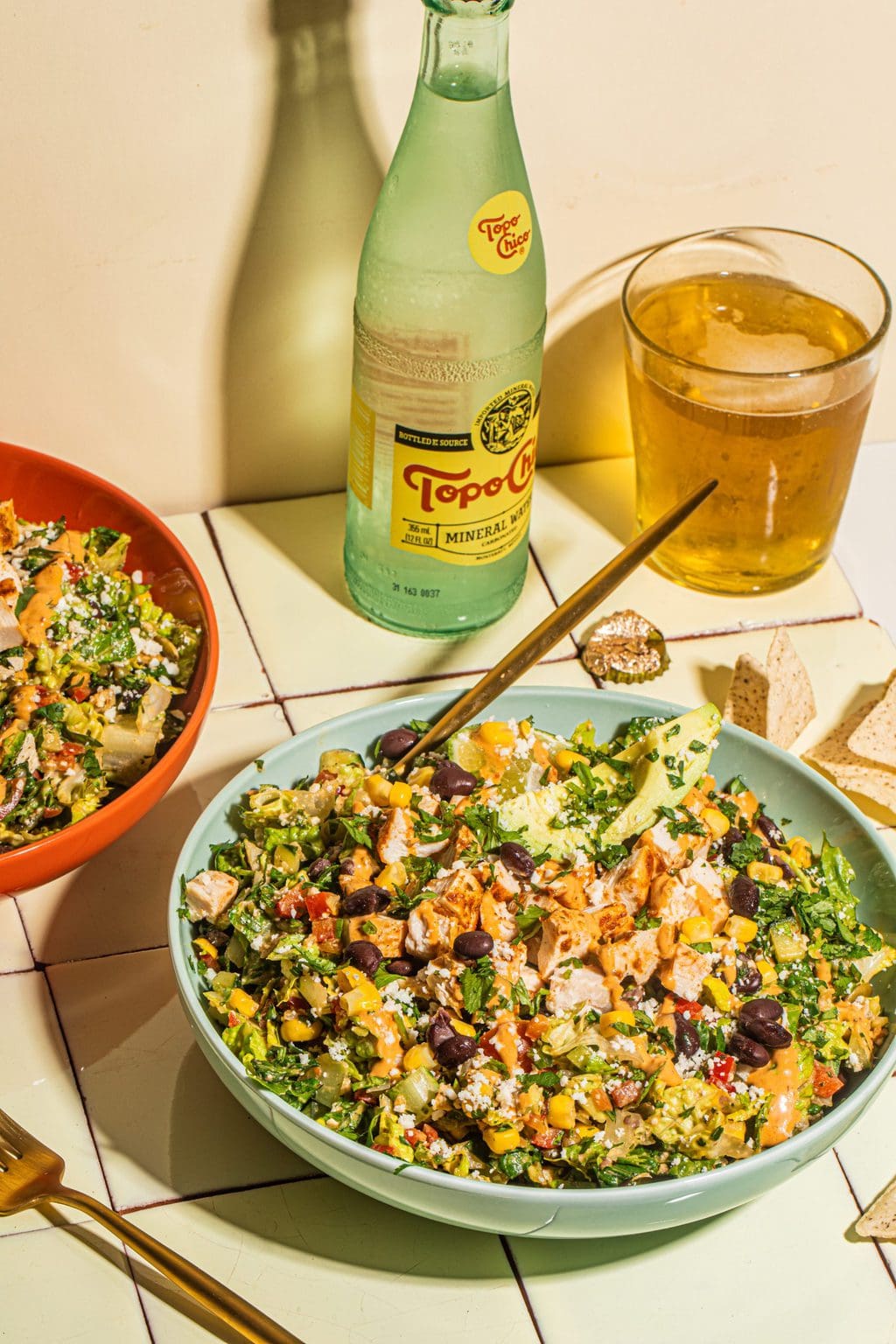 two bowls of southwestern salad recipe with gold fork