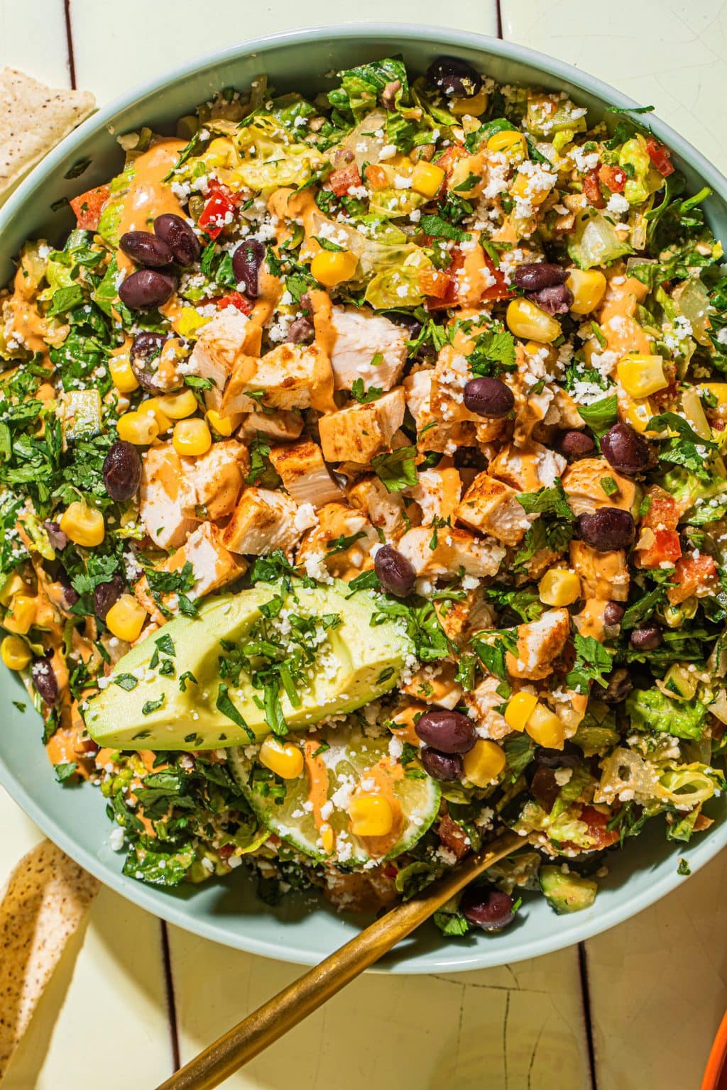 southwest chopped salad with chipotle lime dressing in large blue bowl