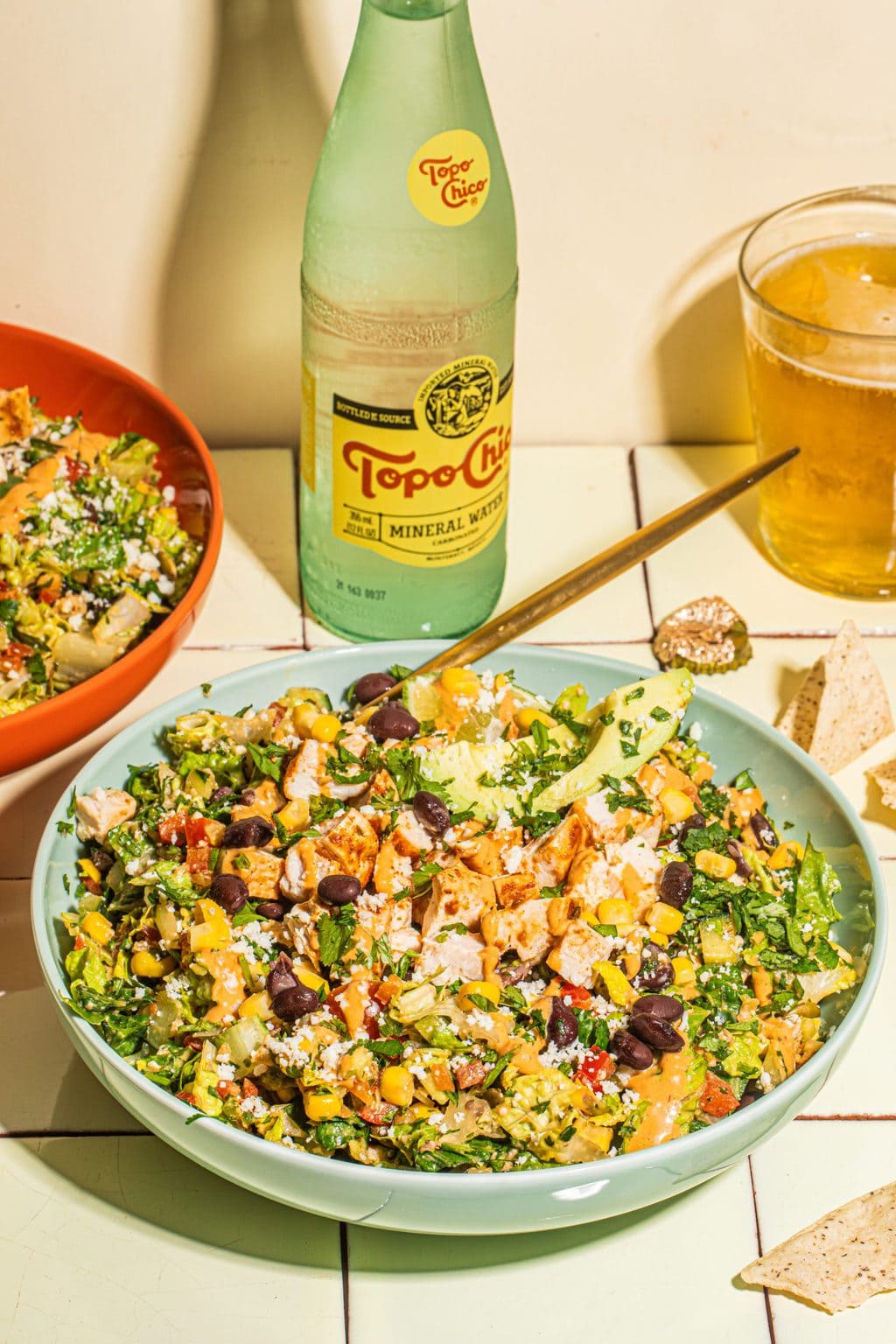 two bowls of southwestern salad recipe with gold fork