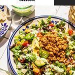 taco salad with ground turkey on large plate with fork