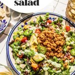 taco salad with ground turkey on large plate with fork