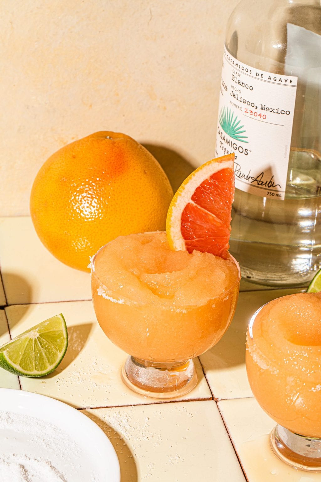 grapefruit tequila cocktail garnished with grapefruit slice