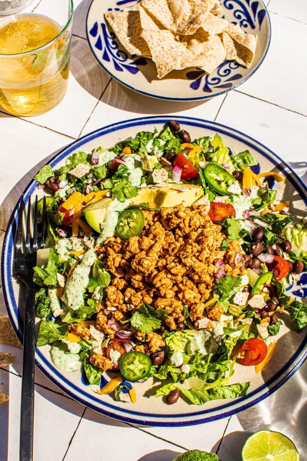 taco salad with ground turkey on large plate with fork