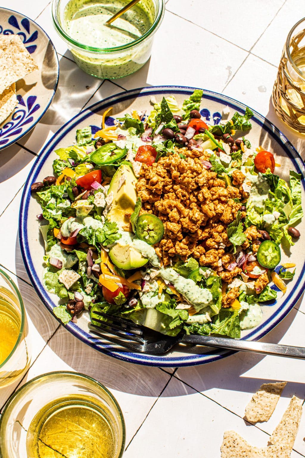 Mexican taco salad on large plate with fork