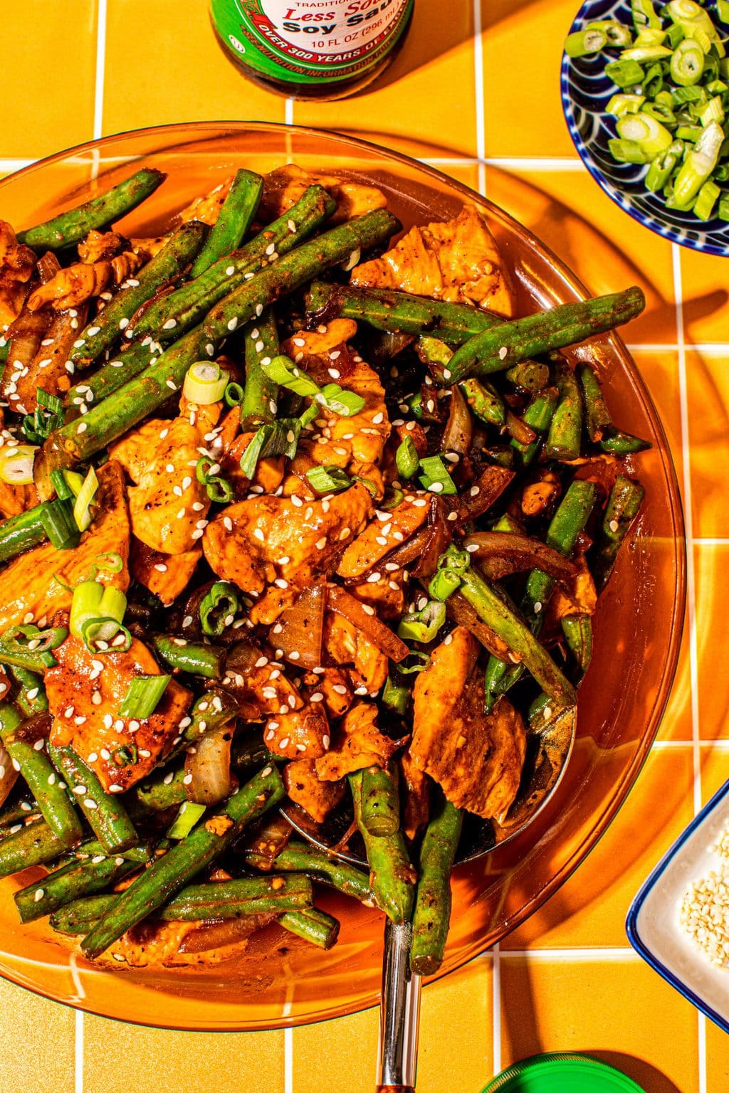 chinese chicken with string beans and garlic sauce on glass platter