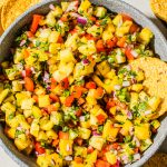 pineapple mango salsa recipe in large bowl with tortilla chip