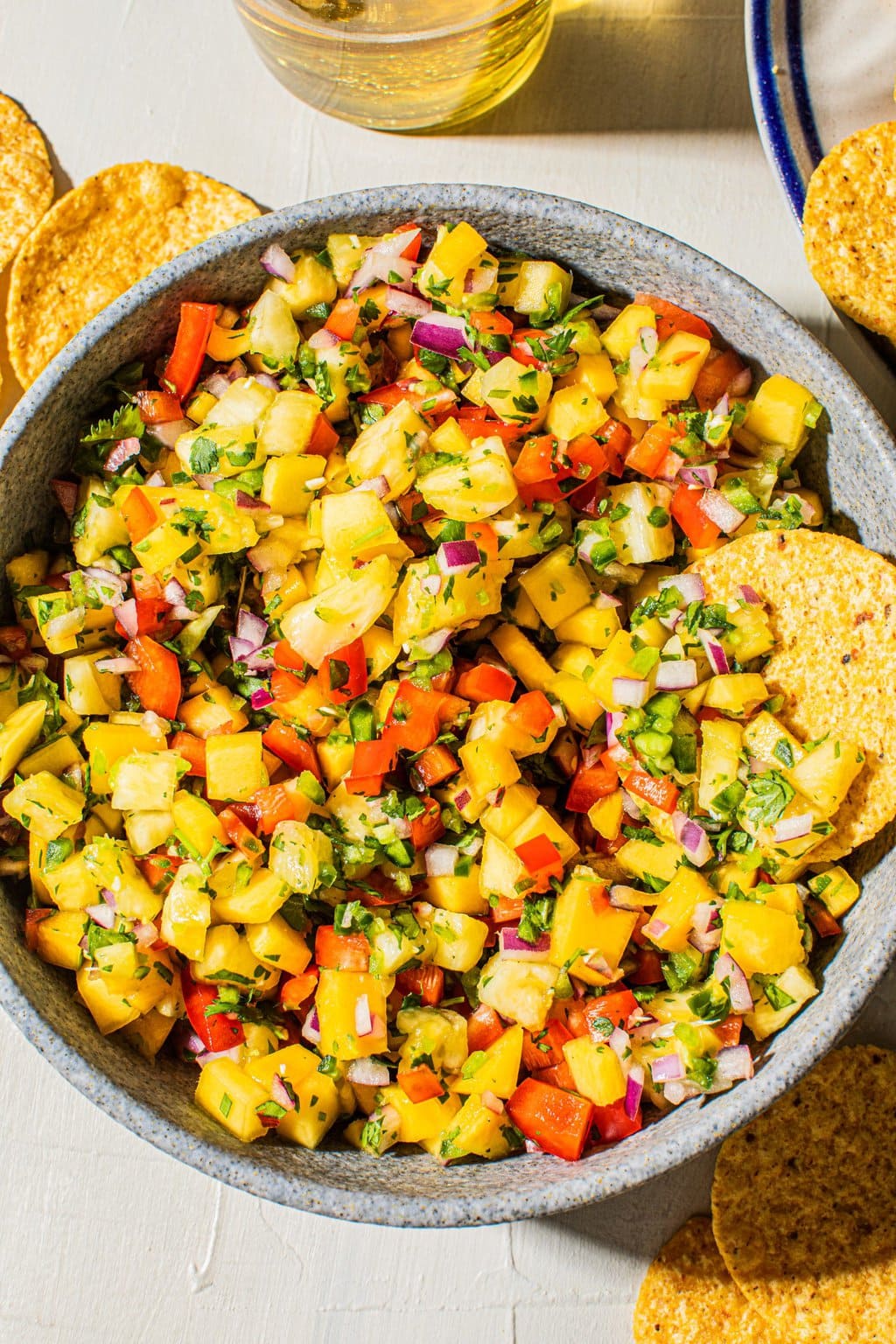 pineapple mango salsa recipe in large bowl with tortilla chip