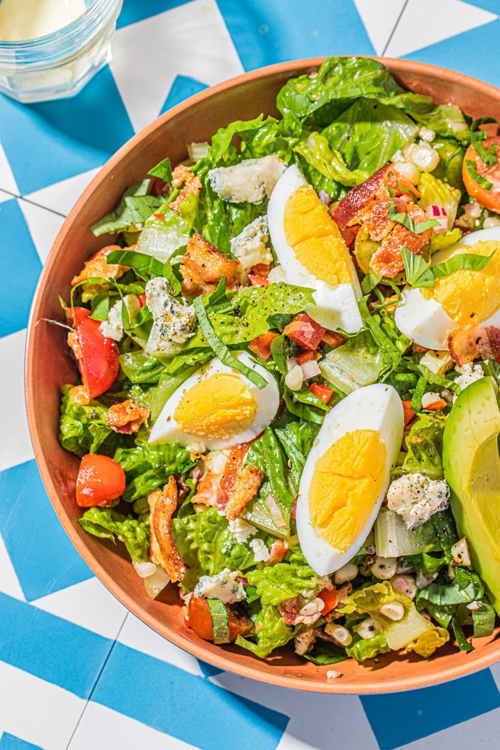 summer cobb salad recipe with corn in bowl