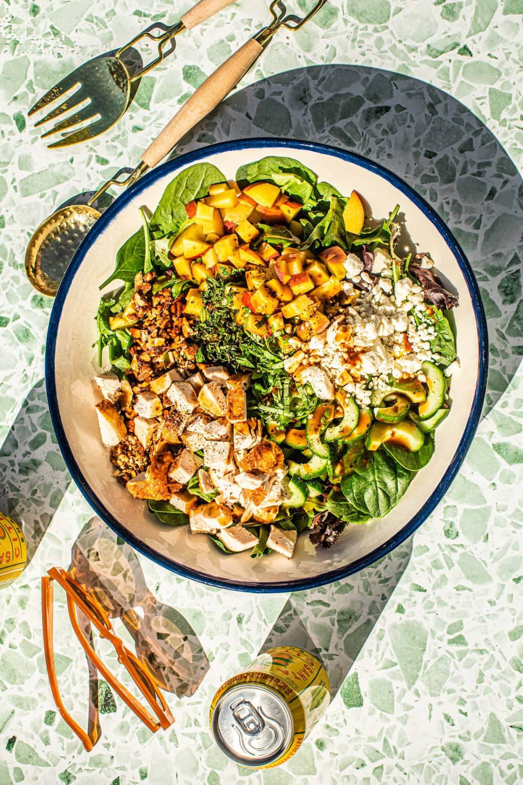 salad with peaches in large white bowl