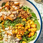 chopped peach salad in large white bowl