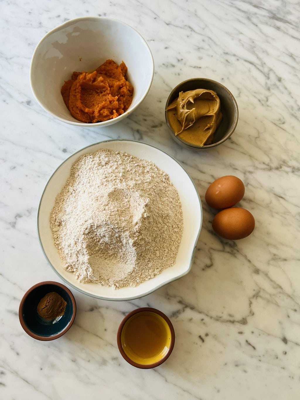 pumpkin puree, peanut butter, whole wheat flour, eggs, cinnamon, apple juice 