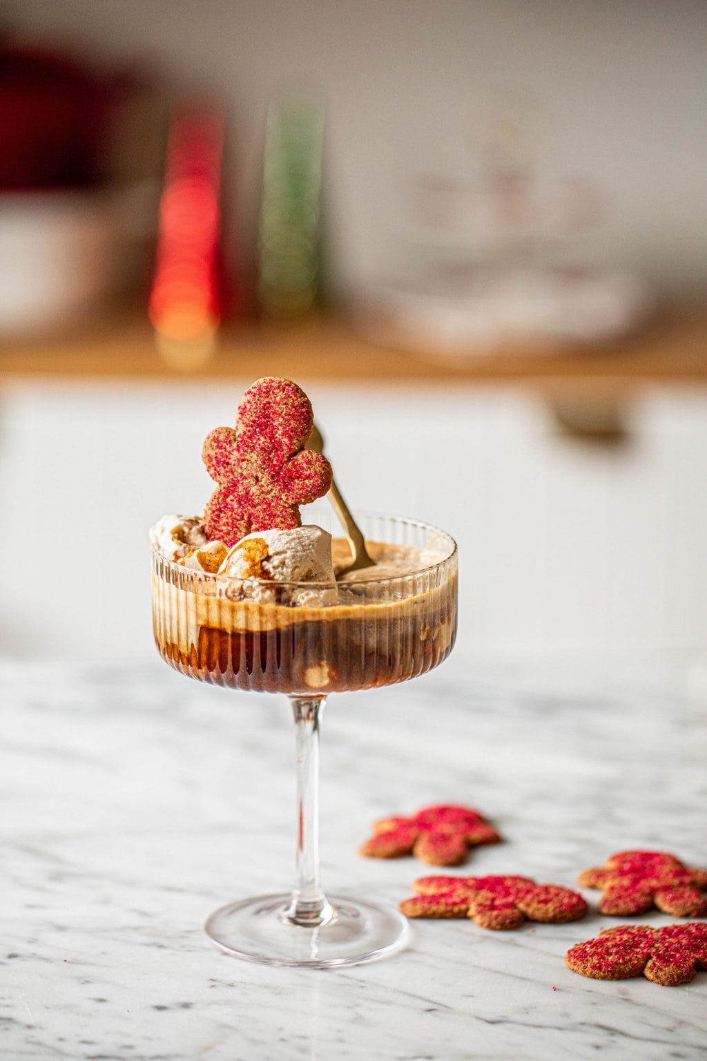 gingerbread affogato in coupe glass with spoon and gingerbread cookies