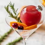 pomegranate ornamentini with fresh cranberries, orange slices and rosemary