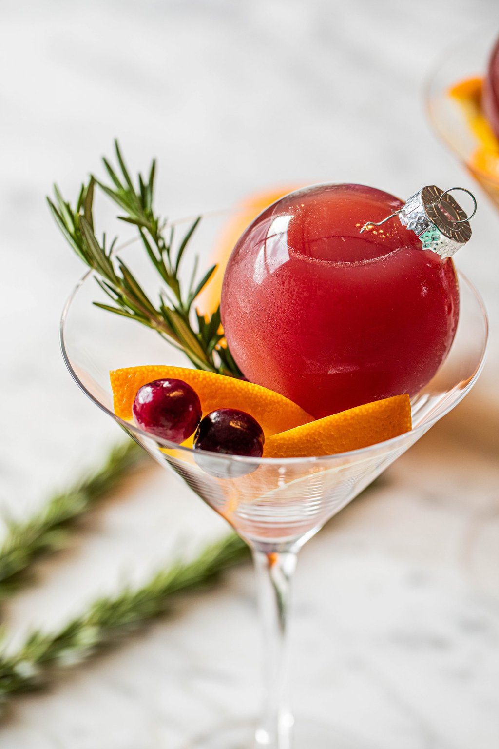 pomegranate ornamentini with fresh cranberries, orange slices and rosemary